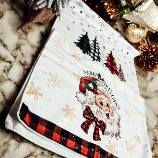 Vintage Santa kitchen decor featuring gingham and gold accents
Christmas kitchen towel with retro Santa Claus and festive snowflakes
Classic Santa dish towel with red gingham edges for holiday decor